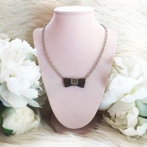 Hello Drama Lucite Silver Skull and Bow Necklace